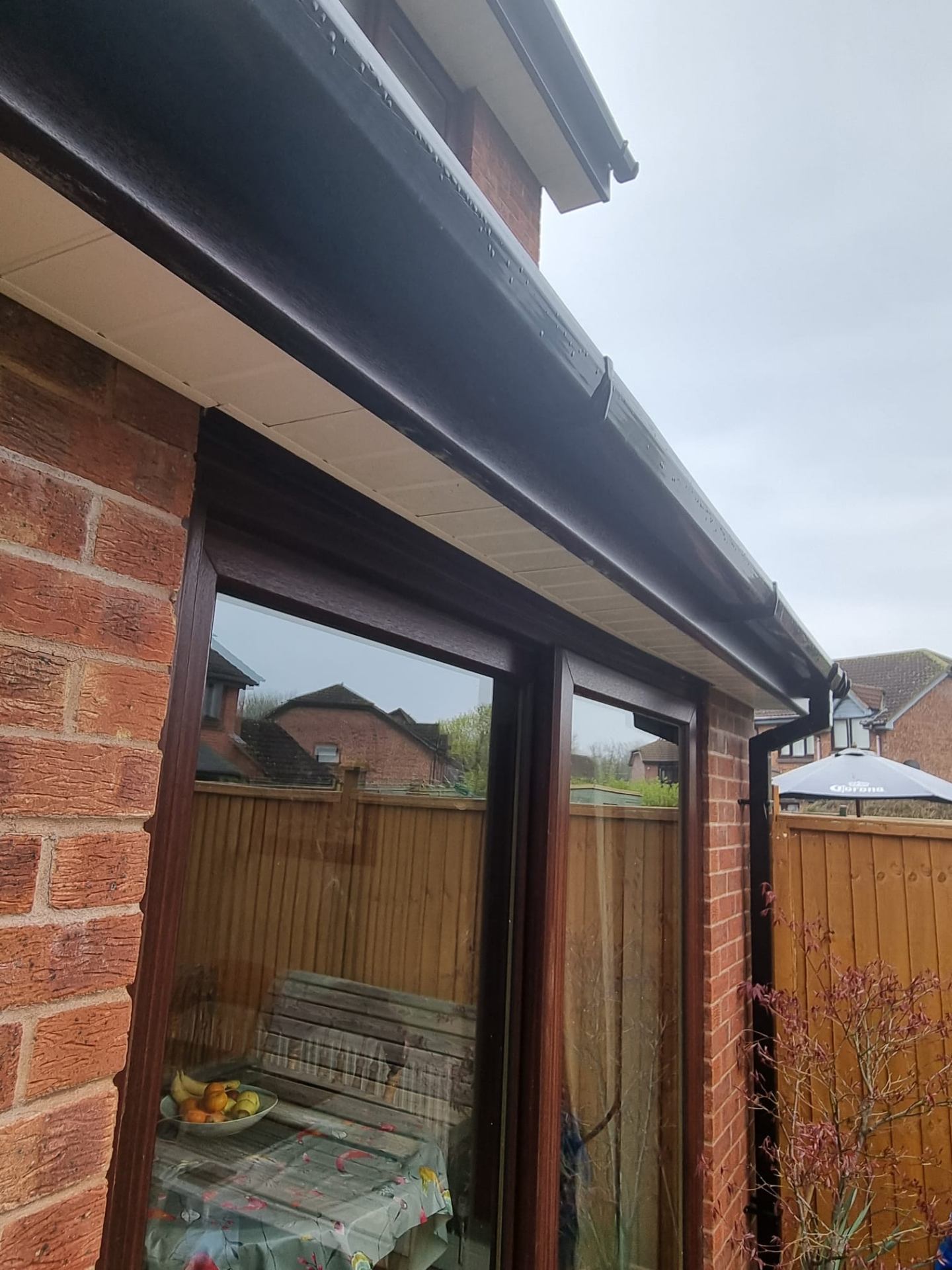 Replacement black fascia, soffit and guttering completed by The Gutter Guys
